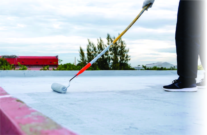 Applying white membrane to a roof