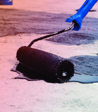 Applying black membrane with a roller